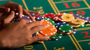Live baccarat betting interface showing player options and real-time dealer action